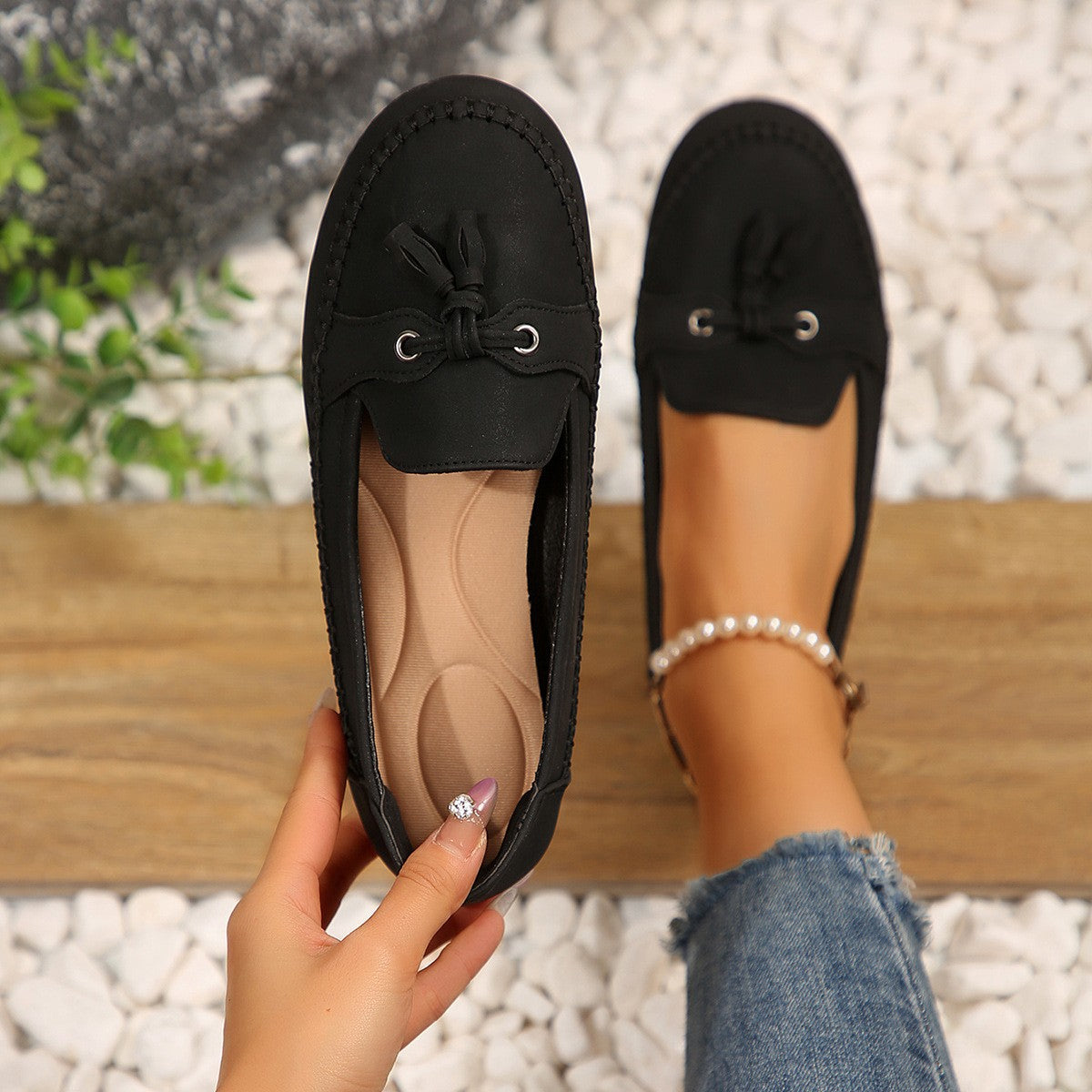 Black tassel loafer, top view