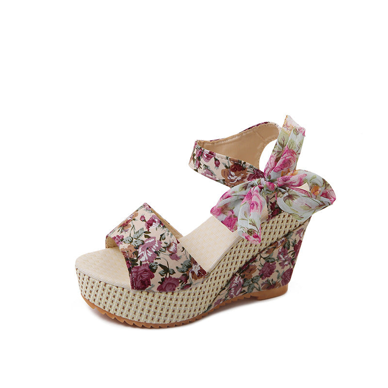 Pink rose-print platform wedge, side view